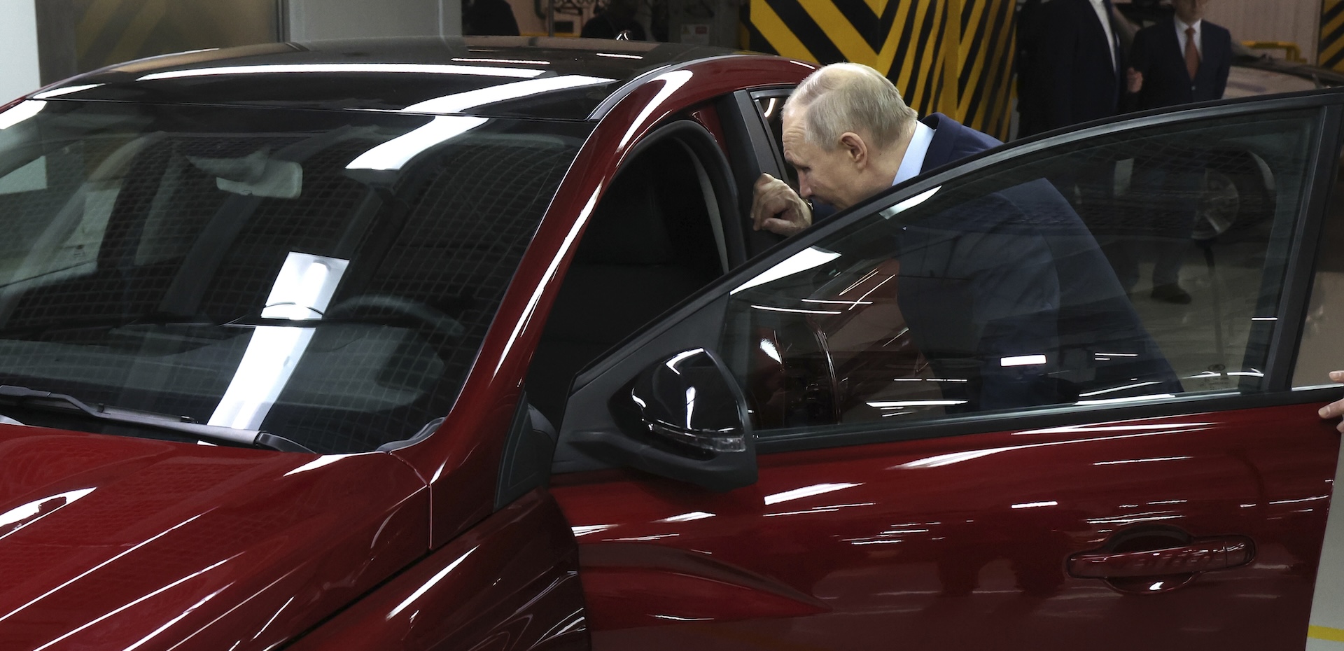 Russian President Vladimir Putin inspects a new Lada Iskra car during a visit to the AvtoVAZ car manufacturing plant in the town of Togliatti,Russia, Jan. 28, 2025. (Vyacheslav Prokofyev, Sputnik, Kremlin Pool Photo via AP)